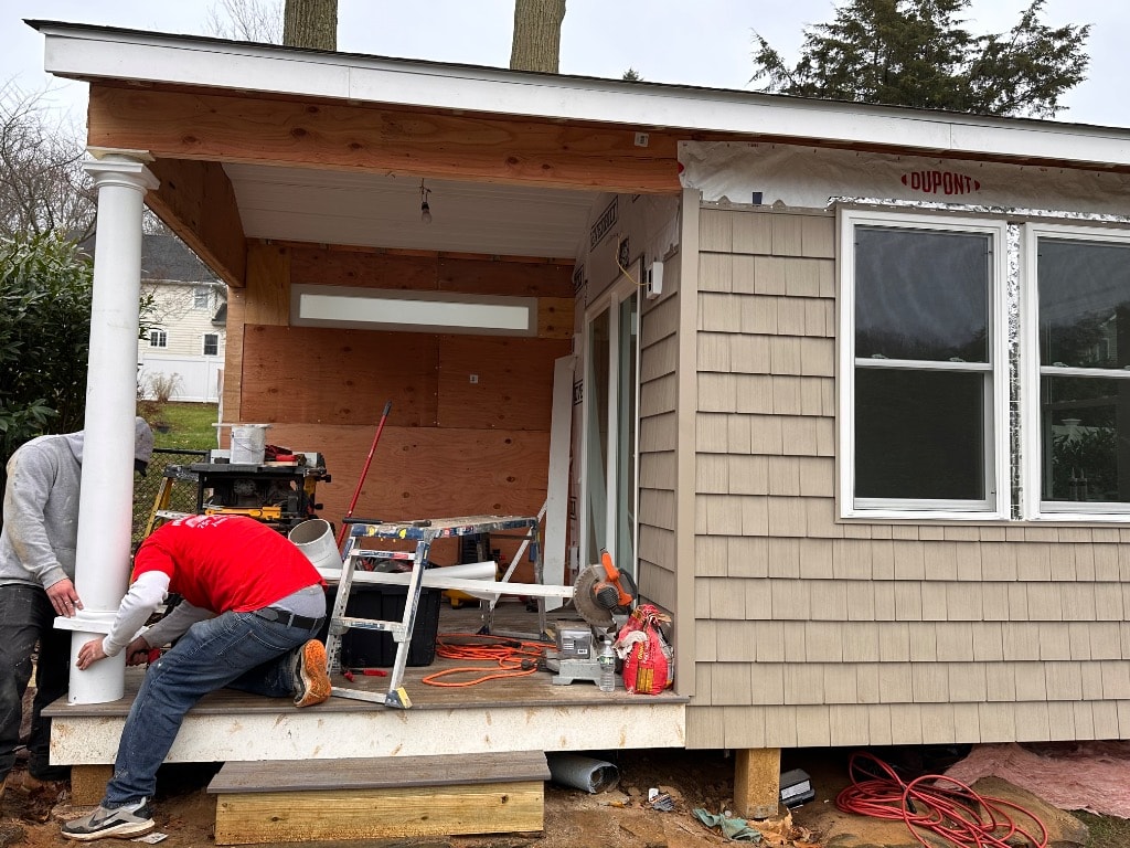 Murray Brothers crew building a covered porch with cedar ceiling and columns